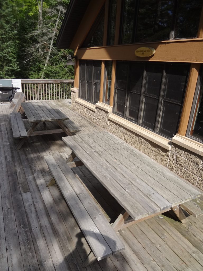 picnic tables on wooden deck